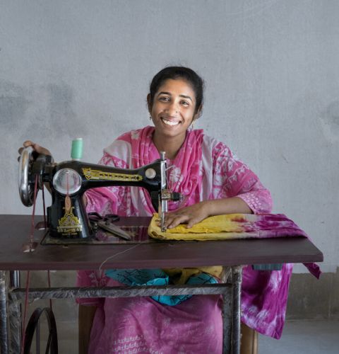 Moriom, 27, a mother of two who survived the Rana Plaza collapse. She accessed training and received a sewing machine from ActionAid's partner to help her back into work.