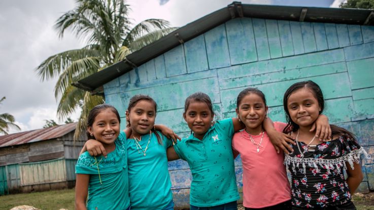 Students at the San Juan Villa Nueva School excitedly write their messages to their sponsors in the UK during Action Aid's annual message collection.