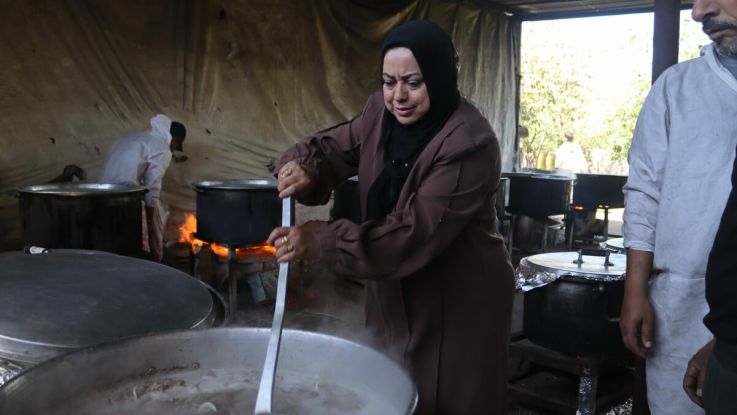 Members of an ActionAid partner organisation, the Women and Child Care Association (WEFAQ), distributing food in Gaza.